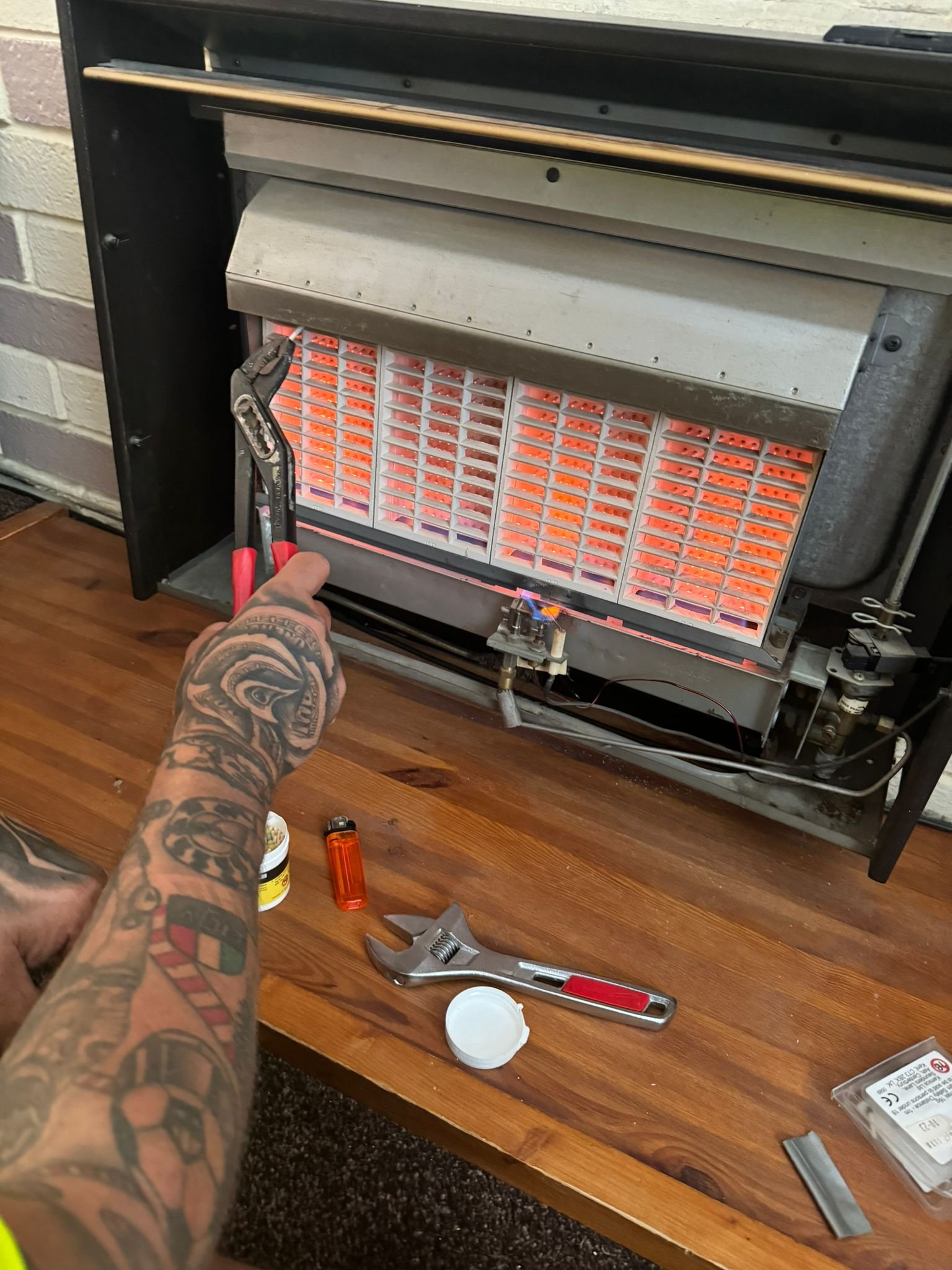Gas engineer carrying out a full strip-down boiler and gas fire service in Spalding.